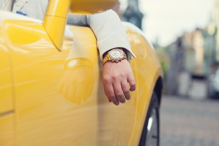 Wealthy man's watch in Porsche